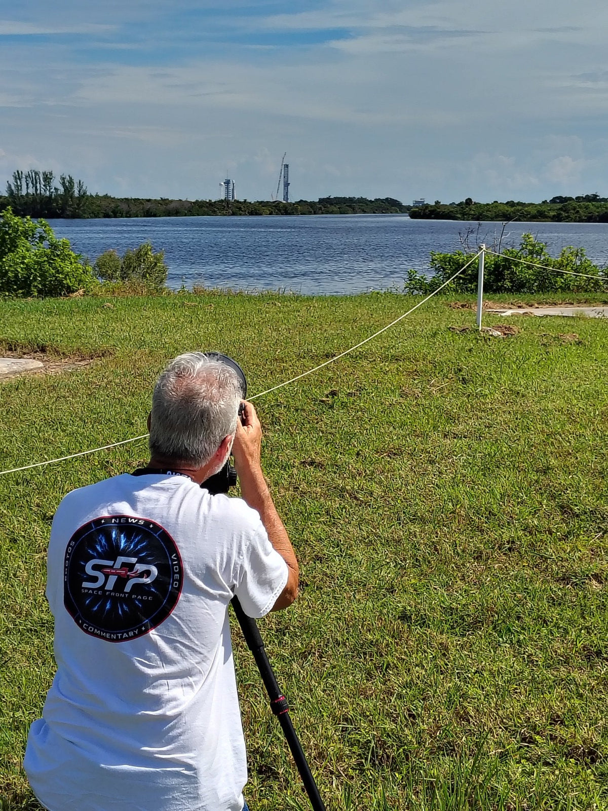 Dennis Hlavsa photographing the launch pad in a Space Front Page shirt